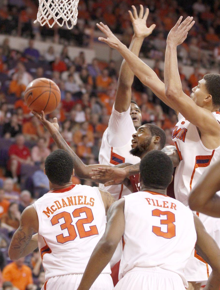 N.C. State's Richard Howell shoots as Clemson's Devin Booker, Milton Jennings, K.J. McDaniels and Adonis Filer guard him during the second half of N.C. State's 58-57 victory over Clemson Sunday, Feb. 10, 2013, at Littlejohn Coliseum in Clemson, S.C.