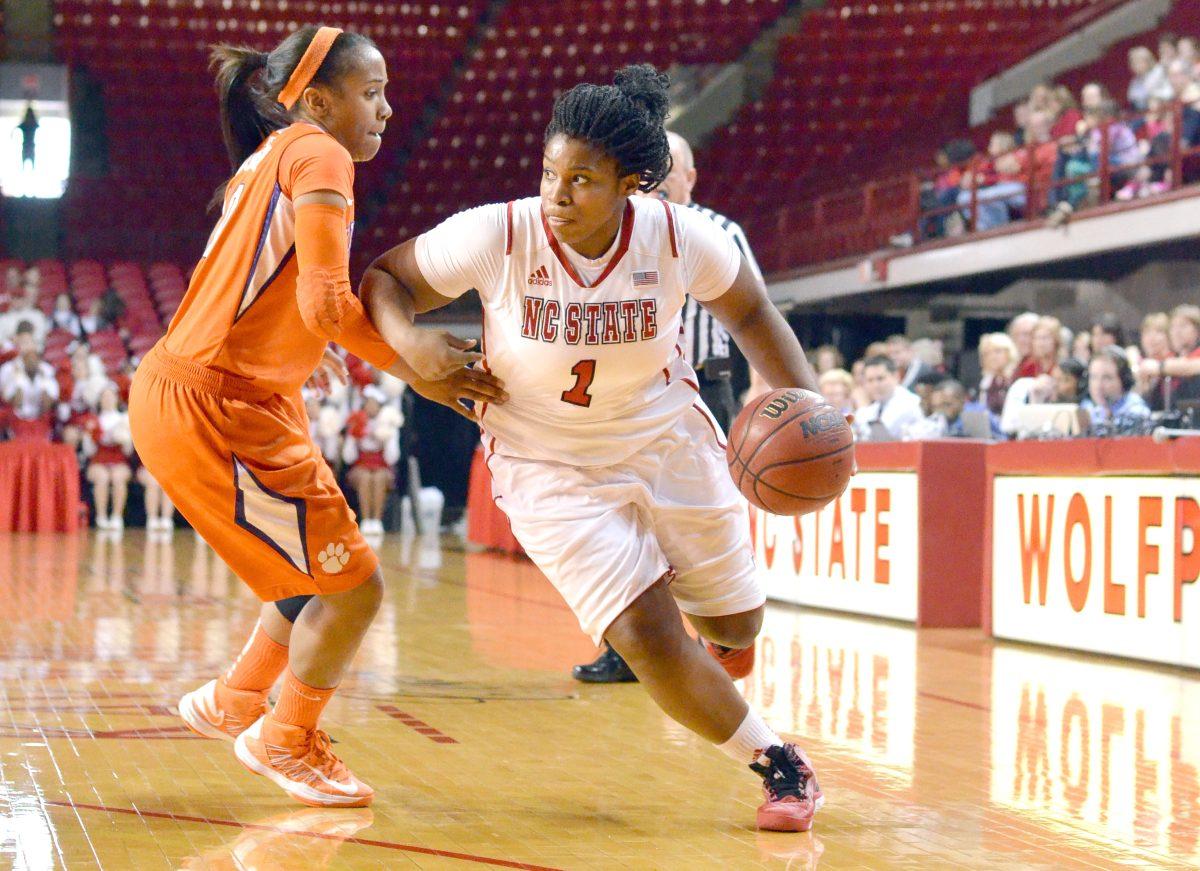 Junior guard Myisha Goodwin-Coleman drives past Clemson's Aisha Turner Sunday Feb. 10 in Reynolds Coliseum. The Wolfpack defeated the Tigers 79-45. Photo by Chris Rupert