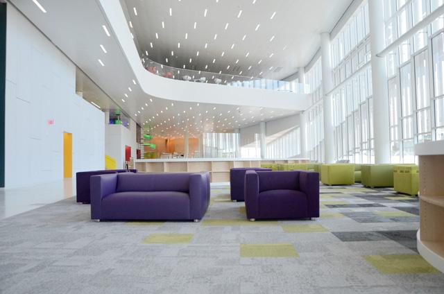 The attrium on the main level of the Hunt Library features chairs and space for students to sit and relax with friends or work on homework. The Hunt Library features new technology that has never been used on college campuses before. Photo by Ryan Parry.