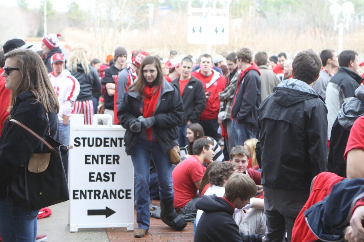 Students gather outside the PNC Arena student entrance in anticipation for the home game against UNC Chapel Hill.