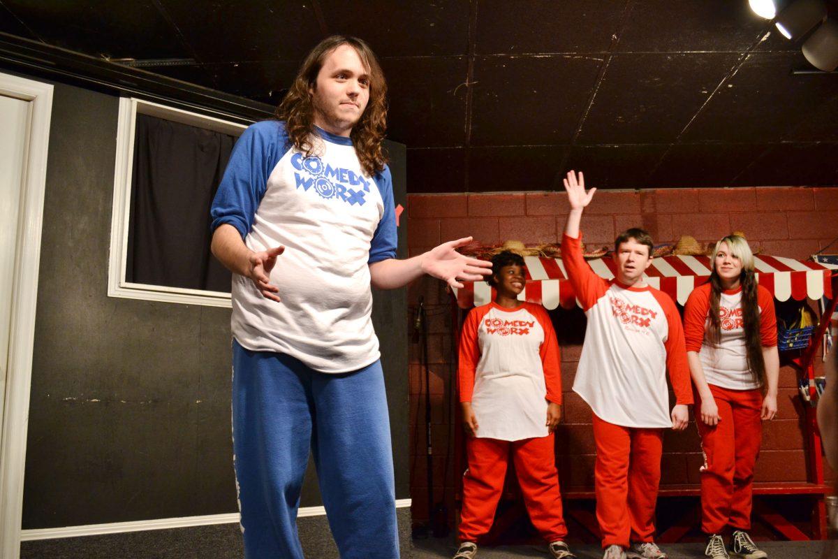 At Comedy Worx, a competitive improve comedy game show on 1 Feb 2013, comedian Bailey Pate plays Challenge, a game where the person who is "it" speaks on a audience supplied topic, Doctors tonight, and other players yell, "Challenge!" when they think the "it" person has said something false. Jason Matthews challenges Pate. Photo by Kelsey Beal