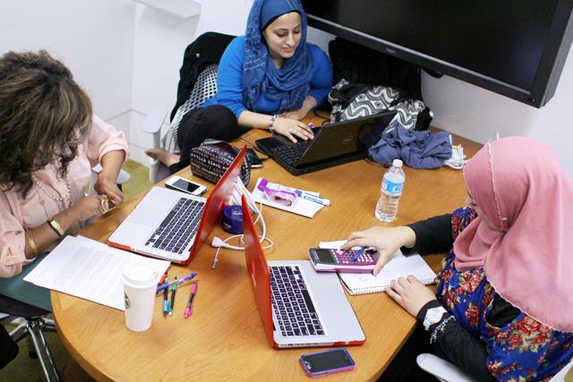 Yasmine Ahmed, Milah Mohsin and Nisma Gabr study in a small group study room in the Hunt Library Saturday.