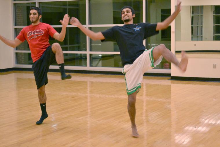 Senior in business administration, Akash Mahtani (left), and sophomore in electrical engineering, Iftekhar Hassan (right) run through the Bhangra Dance Team's routine for their upcoming competition. "[We] compete at competitions along the east coast," Mahtani said. "We're usually in traditional clothing and have props," Hassan added. Photo by Kelsey Beal
