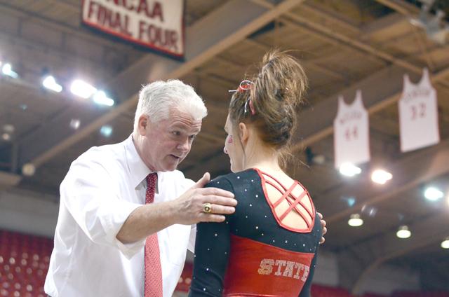 N.C. State head coach Mark Stevenson talks to junior Kristen Harabedian before her floor routine.&#160;