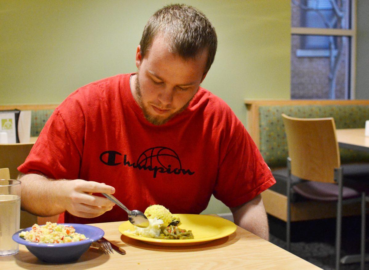 Joe Murray, vegetarian and senior in mathematics, dines at Clark Dining Hall Monday evening, Feb. 11, 2013. There is an ongoing discussion on campus about whether or not University Dining provides enough vegan and vegetarian options for students. "The only thing I would request is that they serve more fresh fruit, more often," said Murray, who thinks University Dining does a great job accommodating for vegetarian and vegan students.&#160;