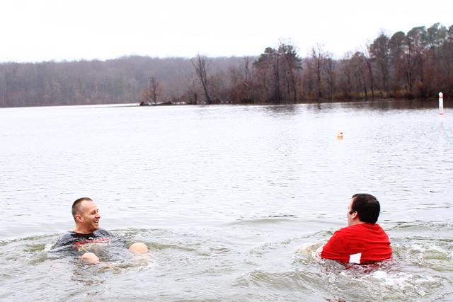 N.C. State Head Football Coach Dave Doeren hangs out in the water after casually walking in the chilly water of Lake Raleigh during the N.C. State Polar Plunge February 23, 2013. Photo by Katherine Hoke