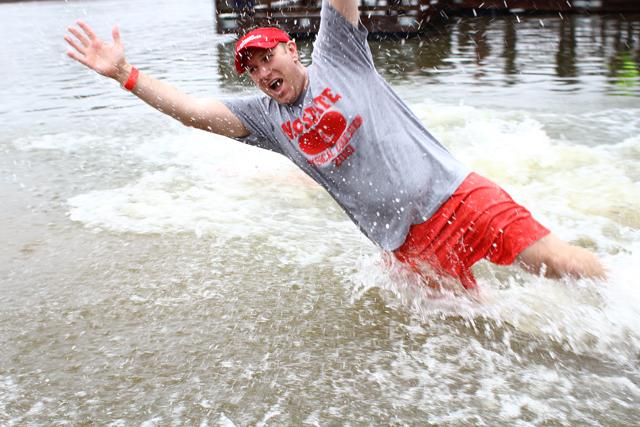 A member of Campus Recreation spashes into Lake Raleigh for the N.C. State Polar Plunge on Saturday February 23, 2013. Partipants of the event raised money for the Special Olympics. Photo by Katherine Hoke