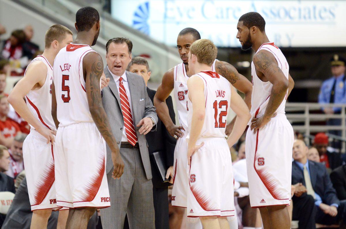 Head coach Mark Gottfried speaks to his team during a time out in the game against Virginia Tech in PNC Arena Saturday, Feb 16, 2013. The Wolfpack defeated the Hokies 90-86 in overtime. Photo by John Joyner.