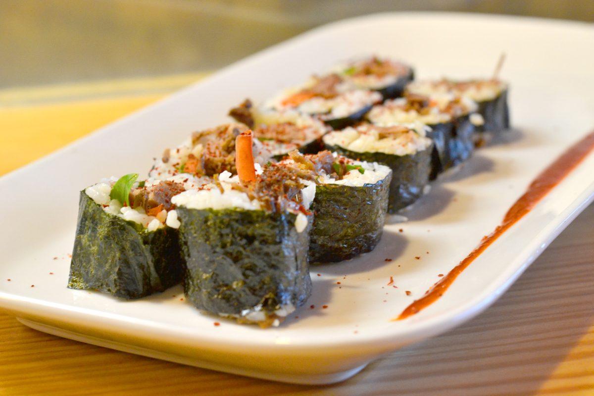 "Kimbap," literally meaning "seaweed rice," is the namesake dish of the restaurant. A braised brisket and basil variation is seen here.&#160;