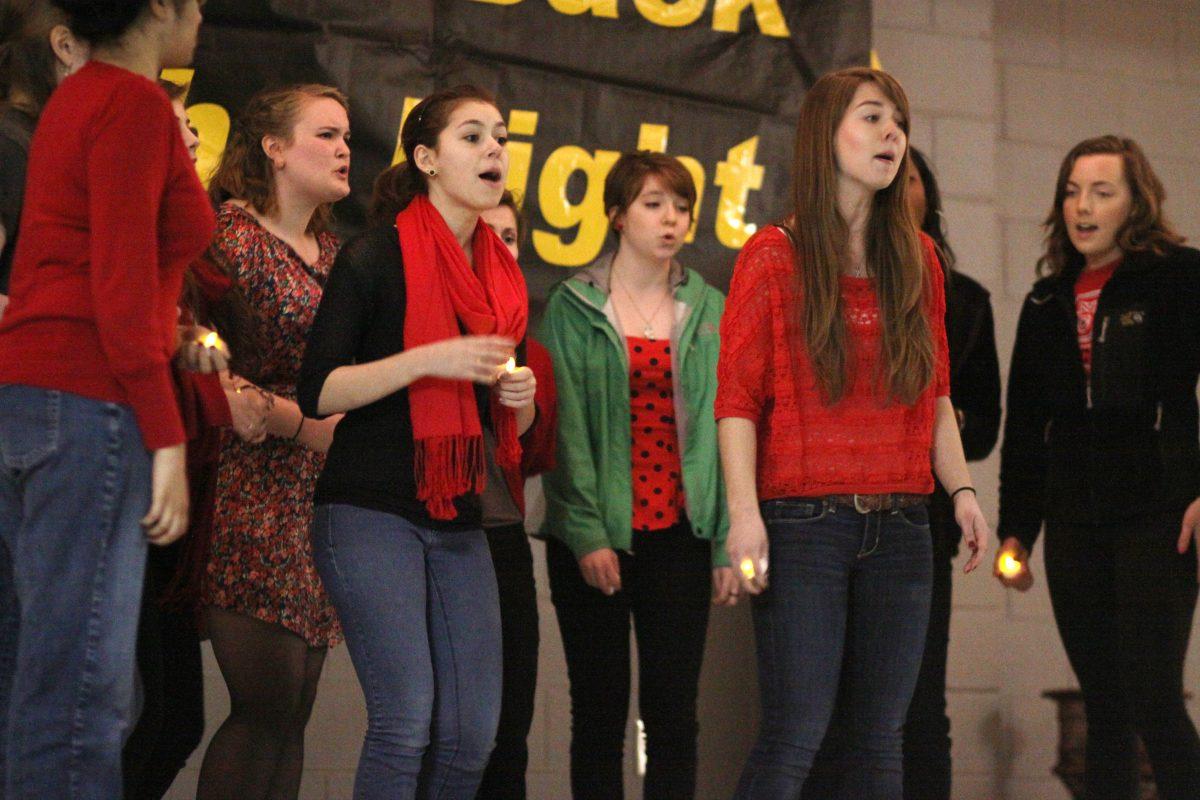 The Ladies in Red, N.C. State's female a cappella group, performs at Take Back the Night.