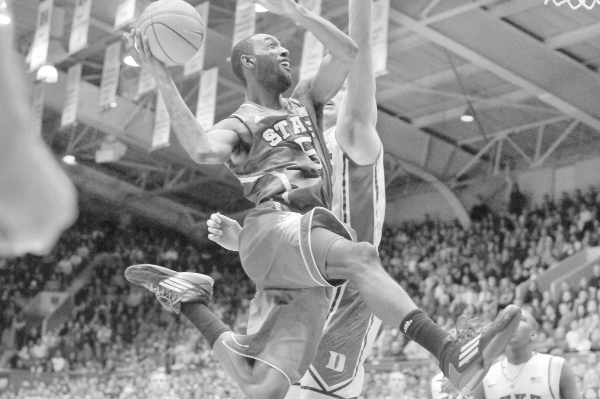 Junior forward C.J. Leslie jumps in the air for a layup during the second half against Duke Thursday, Feb. 7, 2013. Leslie had 16 points in the Wolfpack's 98-85 loss to the Blue Devils at Cameron Indoor Stadium. Photo by Ryan Parry.