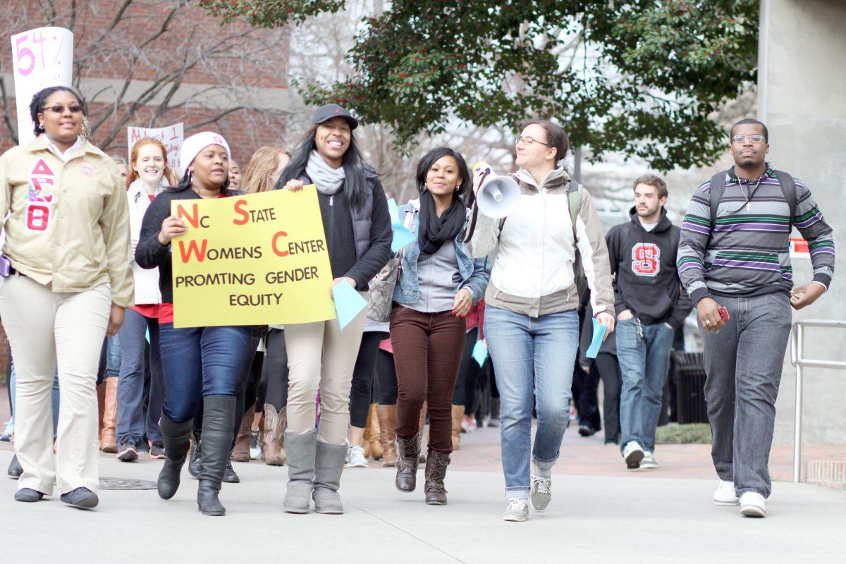 NC State students march to Witherspoon Student Center Monday evening March 25, 2013 as part of the 26th annual Take Back the Night event sponsored by the N.C. State Women's Center.