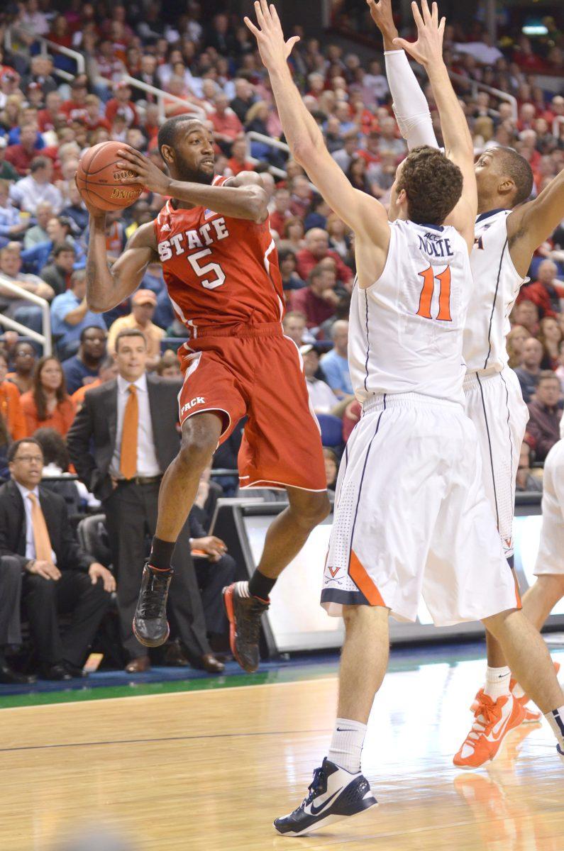 Junior forward C.J. Leslie looks for an opening to pass during the second game of the ACC Tournament against Virginia in Greensboro Coliseum Friday, March 15, 2013. The Wolfpack defeated the Cavaliers 75-56. Photo by John Joyner.