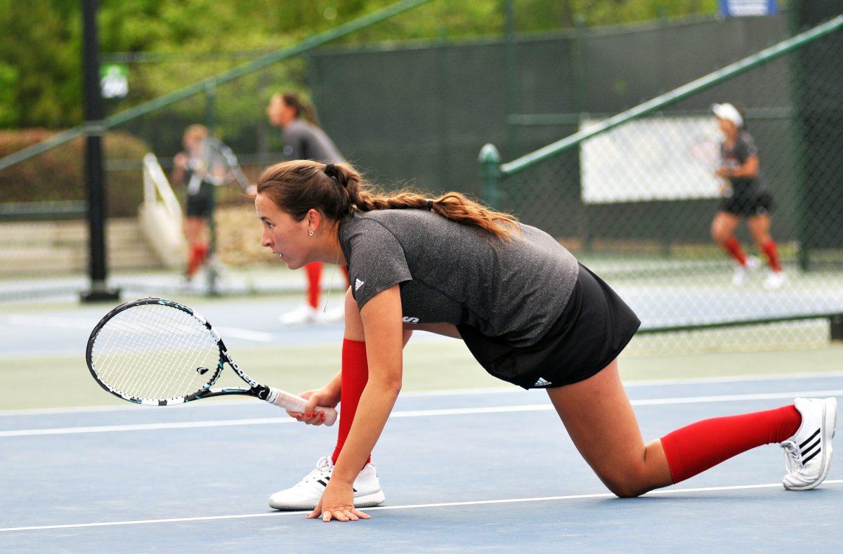 Sophomore Sophie Nelson waits for her partner, senior Chloe Smith, to serve the ball to Boston College Thursday, April 25, 2013. The Wolfpack defeated the Eagles 4-1 in round one of the ACC Tournament at Cary Tennis Center. Photo by Ryan Parry.