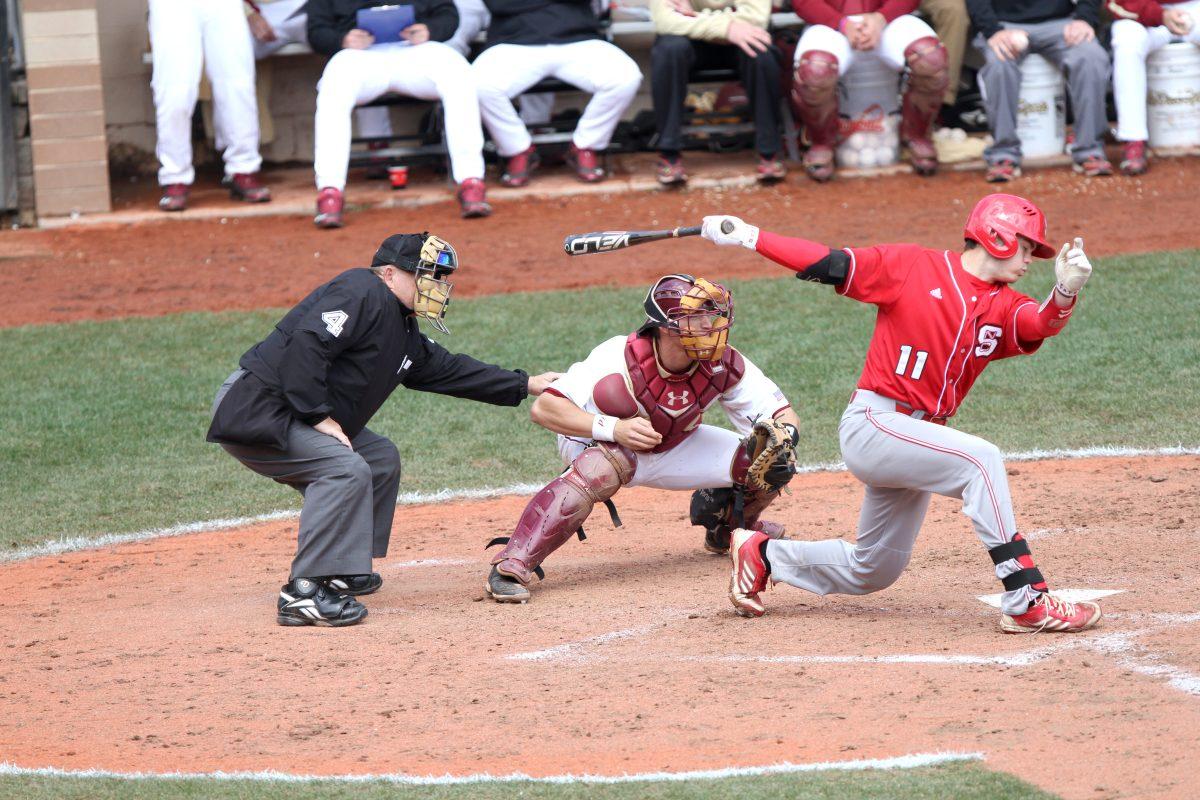 Sophomore catcher Brett Austin attempts a swing from a Boston College pitcher. The Pack completed the sweep of the Eagles over the weekend.&#160;