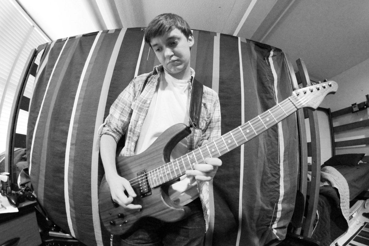 Ricky Hopper, sophomore in computer science, has built his own guitar. "I wasn't satisfied with any guitar out there and wanted something unique," says Hopper.