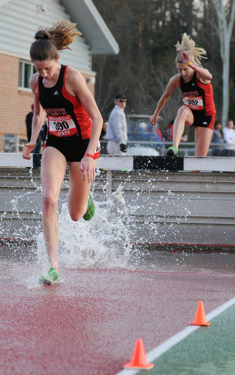 Redshirt juniors Erin Mercer and Samantha Norman come out of the water hurdle during the womens 3000 meter steeplechase race at the Raleigh Relays Friday, March 29, 2013. The Wolfpack women's team finished third in the ACC Outdoor Championships Saturday in Raleigh, it's best finish in the event since the 1986 season. Photo by Ryan Parry.