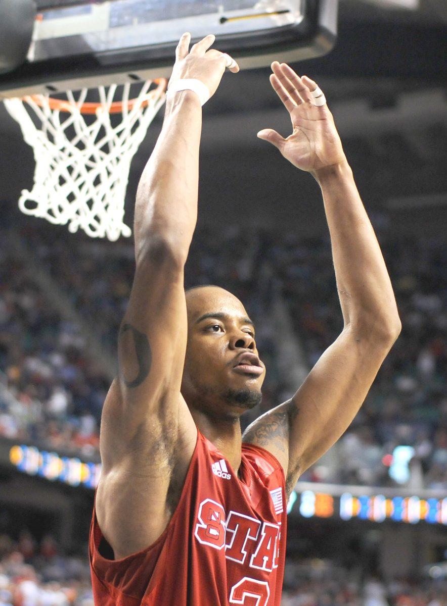 Junior guard Lorenzo Brown pumps up the crowd after a foul is called against Miami Saturday, March 16, 2013. Brown had 6 points and 8 assists in the Wolfpack's 81-71 loss to the Hurricanes at Greensboro Coliseum. Photo by Ryan Parry.