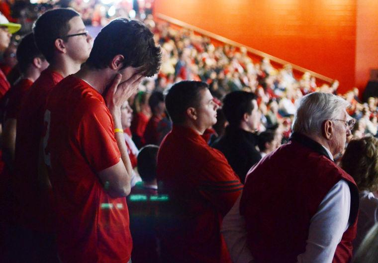 Greg Moore, a junior in sport management, holds his hands over his face after N.C. State fell to Temple during the second round of the NCAA Tournament at the University of Dayton Friday, March 22, 2013. The Wolfpack fell to the Owls 76-72 in Dayton, Ohio. Photo by Ryan Parry.