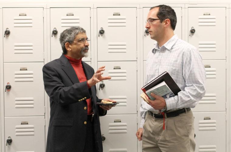 Vikram Rao, Executive Director of the Research Triangle Energy Consortium and member of the N.C. Mining and Energy Commision speaks with an audience member after the questionnaire panel. Hydraulic Fracturing in North Carolina was the main topic at this panel discussion. The event took place in the Golden LEAF Biomanufacturing Training and Education Center on Tuesday April 23.