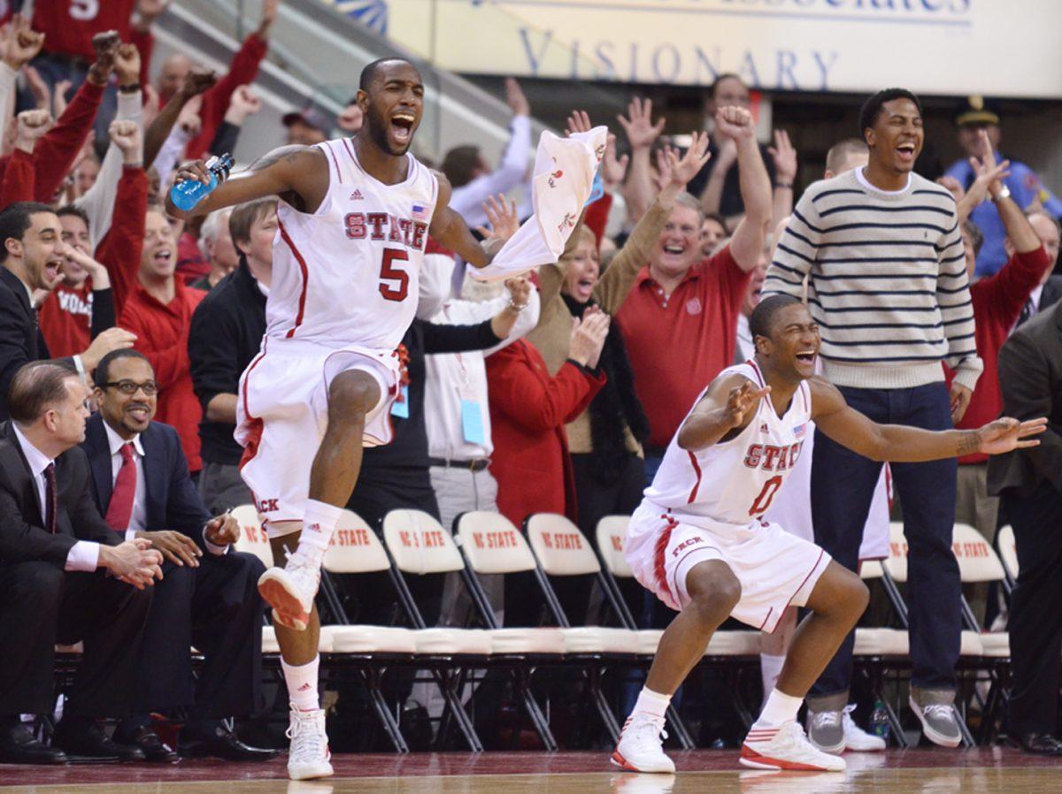 Junior forward C.J. Leslie and freshman guard Rodney Purvis reach to a three point field goal scored by senior guard Jay Lewis during the final home game against Wake Forest in PNC Arena Wednesday, Mar. 7, 2013. The Wolfpack defeated the Demon Deacons 81-66.&#160;