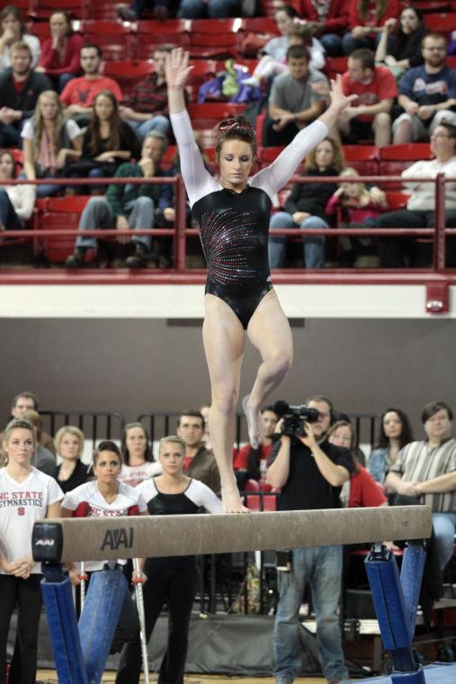 Photo by Joannah Irvin. Junior gymnast Heidi Ffield competes on the beam against Maryland on Jan. 11. The Wolfpack brought their season to a close this weekend, placing fifth at the NCAA Regional Competition in Columbus, Ohio.