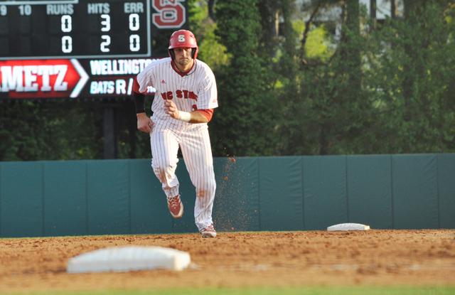 Senior outfielder Tarran Senay runs to third base on a strikeout during the game against Davidson College Tuesday, April 23, 2013. The Wolfpack beat the Wildcats 4-3 with a run in the bottom of the ninth inning.