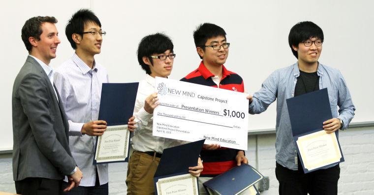 Foreign exchange students in the university preparatory program at N.C. State receive an award after placing first for their presentation at Crossing the Chinese Border Thursday, April 18 2013 in Park Shops. The event was held to allow exchange students from China to discuss their research on building cross-cultural relationships between China and the United States. Photo by Tyler Andrews