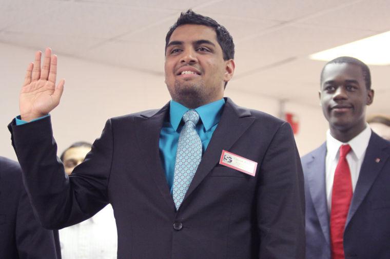 Sagar Patel, sophomore in electrical engineering takes the oath of office as a newly elected student senator. Patel was joined by the rest of the new senetors as they were sworn into office to kick off the first meeting of the 93rd Session of the Student Senate of North Carolina State University.