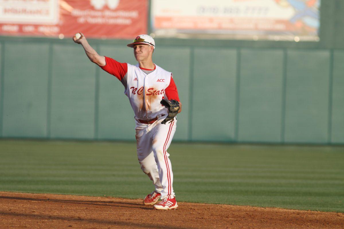 Photo by Joannah Irvin. Sophmore second baseman Logan Ratledge throws to first base during the N.C. State victory against East Carolina on April 9. The 2-0 win improves the Wolfpack record to 25-10 overall and 8-7 in the ACC. The Pack's next home appearance will be at 6 pm on April 23 against Davidson College.