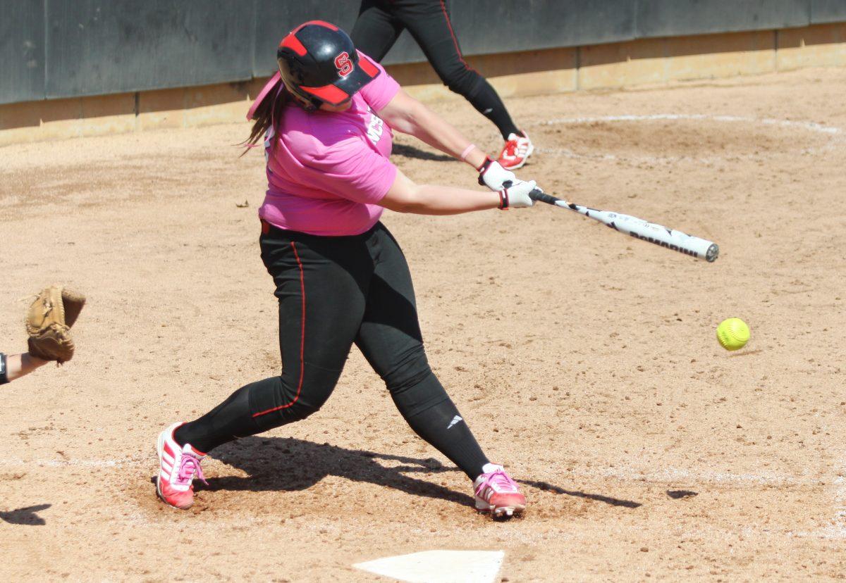 Freshman first baseman Hanna Sommer hits a ground ball against Maryland at Dail Softball Stadium April 6, 2013. The Wolfpack took the three-game weekend series 2-1, bringing their record to 5-6 in conference play and 19-17-1 overall. Photo by Caide Wooten.