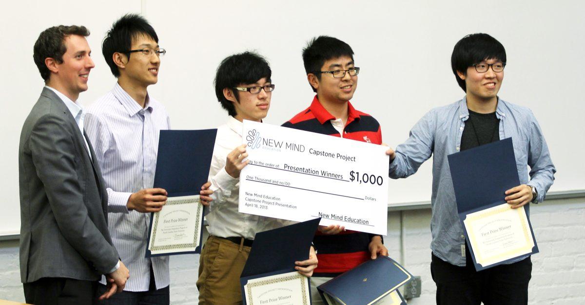 Foreign exchange students in the university preparatory program at N.C. State receive an award after placing first for their presentation at Crossing the Chinese Border Thursday, April 18 2013 in Park Shops. The event was held to allow exchange students from China to discuss their research on building cross-cultural relationships between China and the United States. Photo by Tyler Andrews