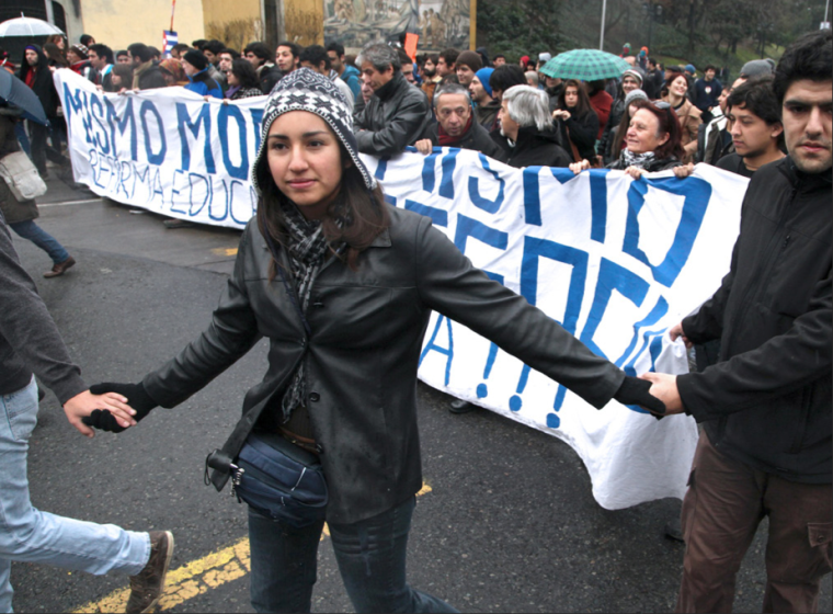 Chilean students form a circle around a group of prominent university leaders to protect them from possible police retaliation. College students in Chile have been protesting for affordable education during the past yearfor.