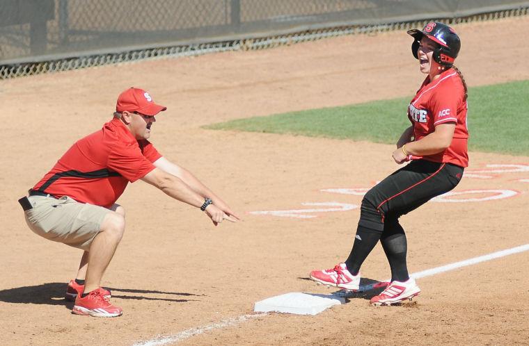 Senior outfielder Bethaney Wells screams as she stops at third base after a double by N.C. State against North Carolina Saturday, April 13, 2013. Wells went 1-for-3 with 2 earned runs in the Wolfpack's 11-8 win against the Tar Heels at Dail Stadium. Photo by Ryan Parry.