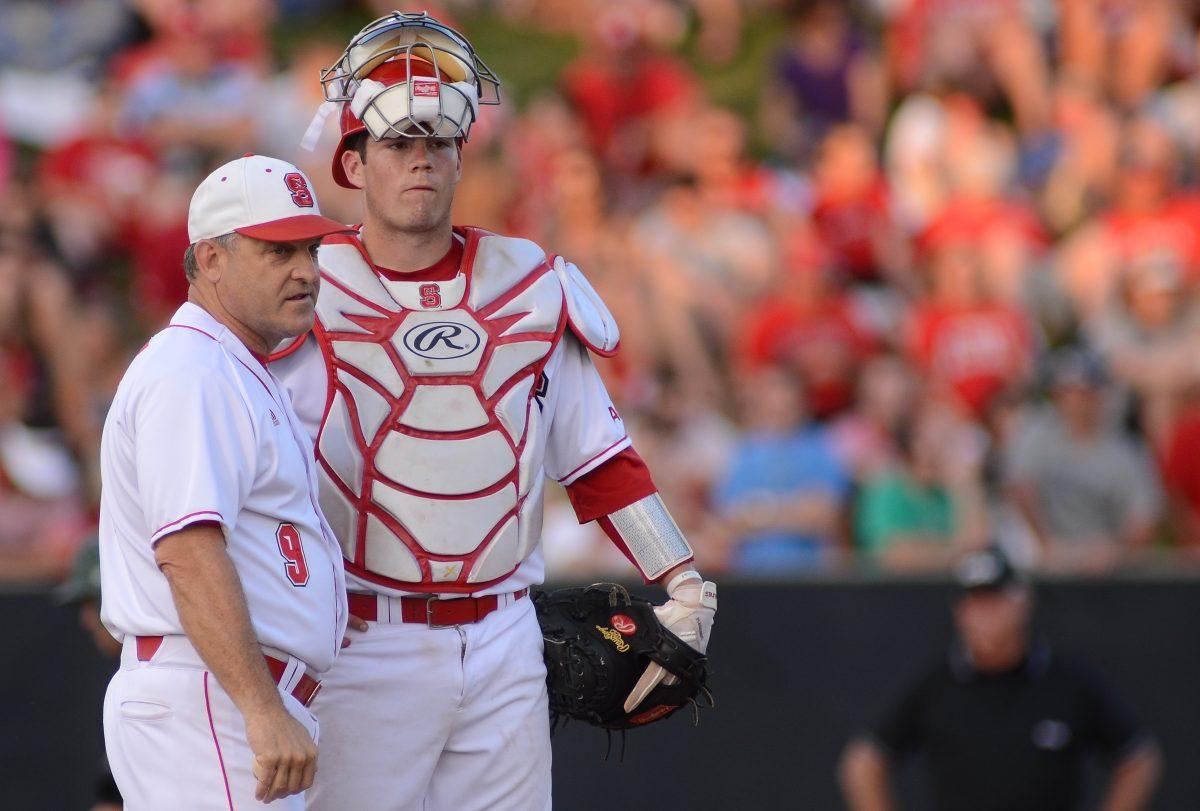 Sophomore catcher Brett Austin stands on the pitchers mound with head coach Elliott Avent during N.C. State's match against Binghamton University Friday, March 31, 2013. The Wolfpack defeated the Bearcats 4-1 at Doak Field at Dail Park. Photo by Ryan Parry.