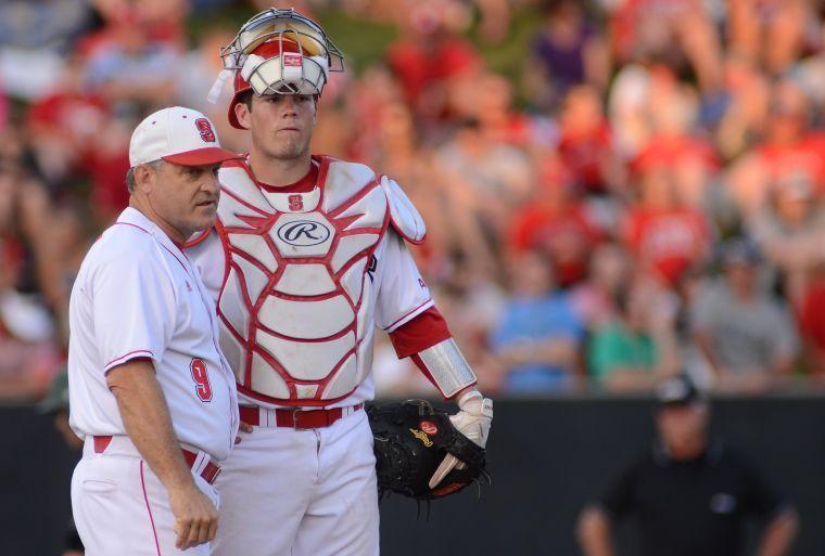 Sophomore catcher Brett Austin stands on the pitchers mound with head coach Elliott Avent during N.C. State's match against Binghamton University Friday, March 31, 2013. The Wolfpack defeated the Bearcats 4-1 at Doak Field at Dail Park. Photo by Ryan Parry.