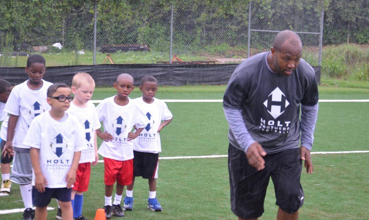 Torry Holt demonstrates drill at the Holt Brothers Football Camp