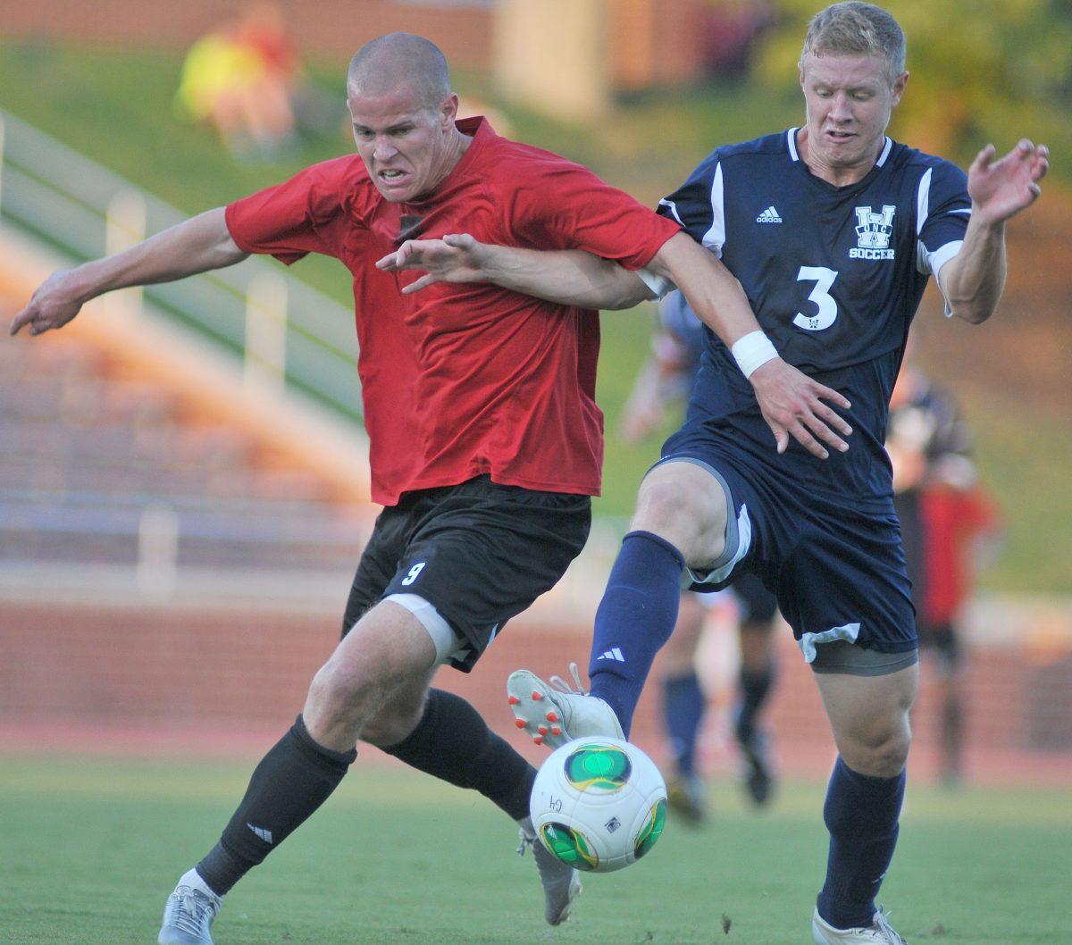 Senior forward Nick Surkamp fights to gain possession of the ball against a UNC-Wilminton player Saturday, August 24, 2013. The Wolfpack tied the Seahawks 1-1 during their exhibition match at Dail Soccer Stadium.