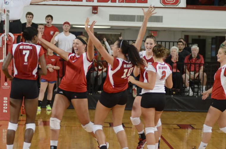 The Wolfpack celebrate a point during the second set against Clemson University September 29, 2012. N.C. State celebrated coach Bryan Bunn's 400th victory with a 3-1 win over the Tigers at Reynolds Coliseum.&#160;
