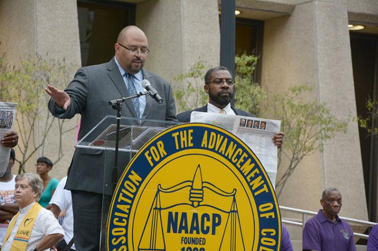 Christopher Hill, director of the N.C. Justice Center speaks at the Forward not Back Rally Aug. 28, 2013 outside the Wake County Courthouse. The event was coordinated by the NAACP and celebrated the 50th anniversary of the "I Have a Dream" speech. Photo by Chris Rupert