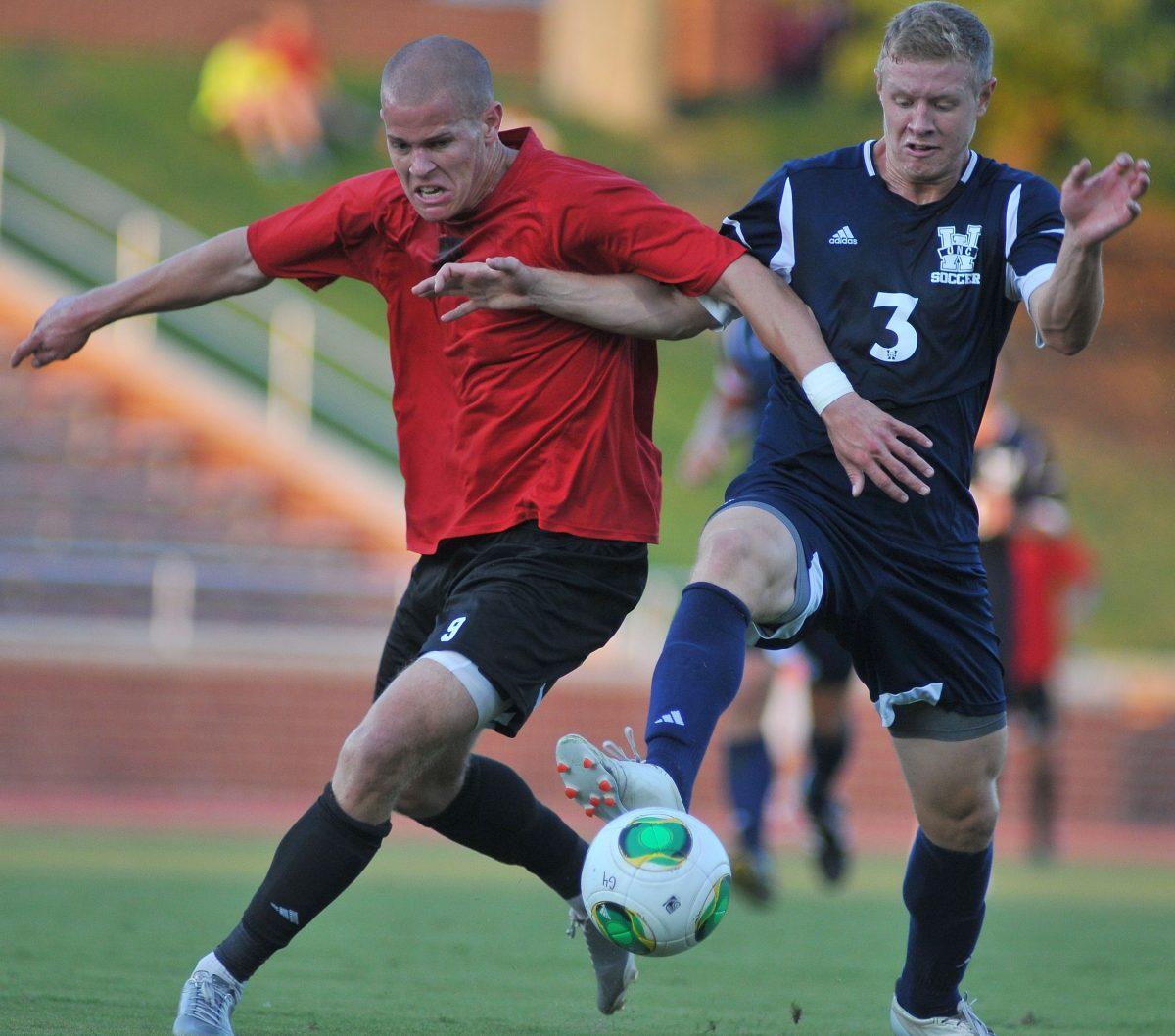 Senior forward Nick Surkamp fights to gain possession of the ball against a UNC-Wilminton player Saturday, August 24, 2013. The Wolfpack tied the Seahawks 1-1 during their exhibition match at Dail Soccer Stadium. Photo by Ryan Parry.