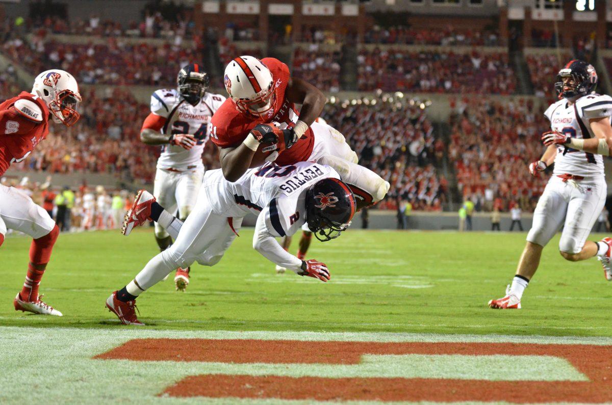 Freshman running back Matt Dayes dives into the end zone during the football game against the University of Richmond in Carter-Finley Stadium Saturday, Aug. 31, 2013. The Wolfpack narrowly defeated the Spiders 23-21.