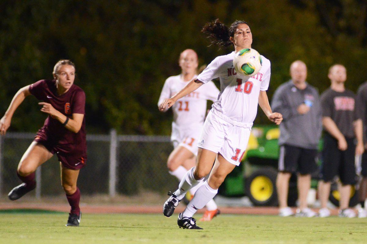 Freshman forward Jackie Stengel bounces the ball off her chest during the soccer match against No. 16 Virginia Tech at Dail Soccer Field Thursday Sept. 26, 2013. The Wolfpack fell to the Hokies 4-1. Photo by John Joyner.