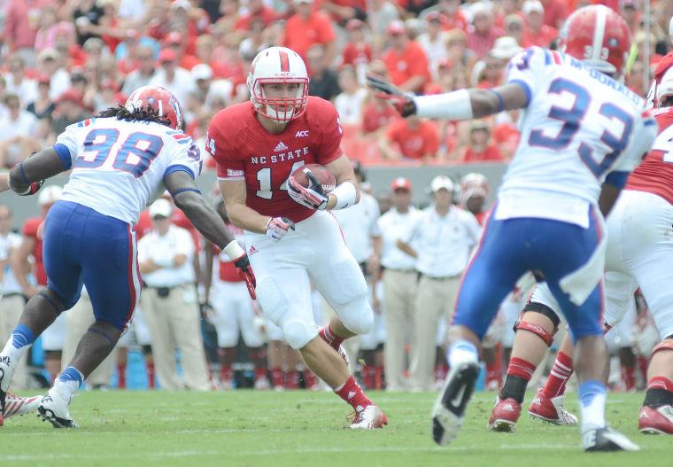 Freshman fullback Bryant Shirreffs rushes the ball against Louisiana Tech Saturday, August 31, 2013. Shirreffs had 9 rushes for 34 yards in the Wolfpack's 40-14 win against the Bulldogs at Carter-Finley Stadium.