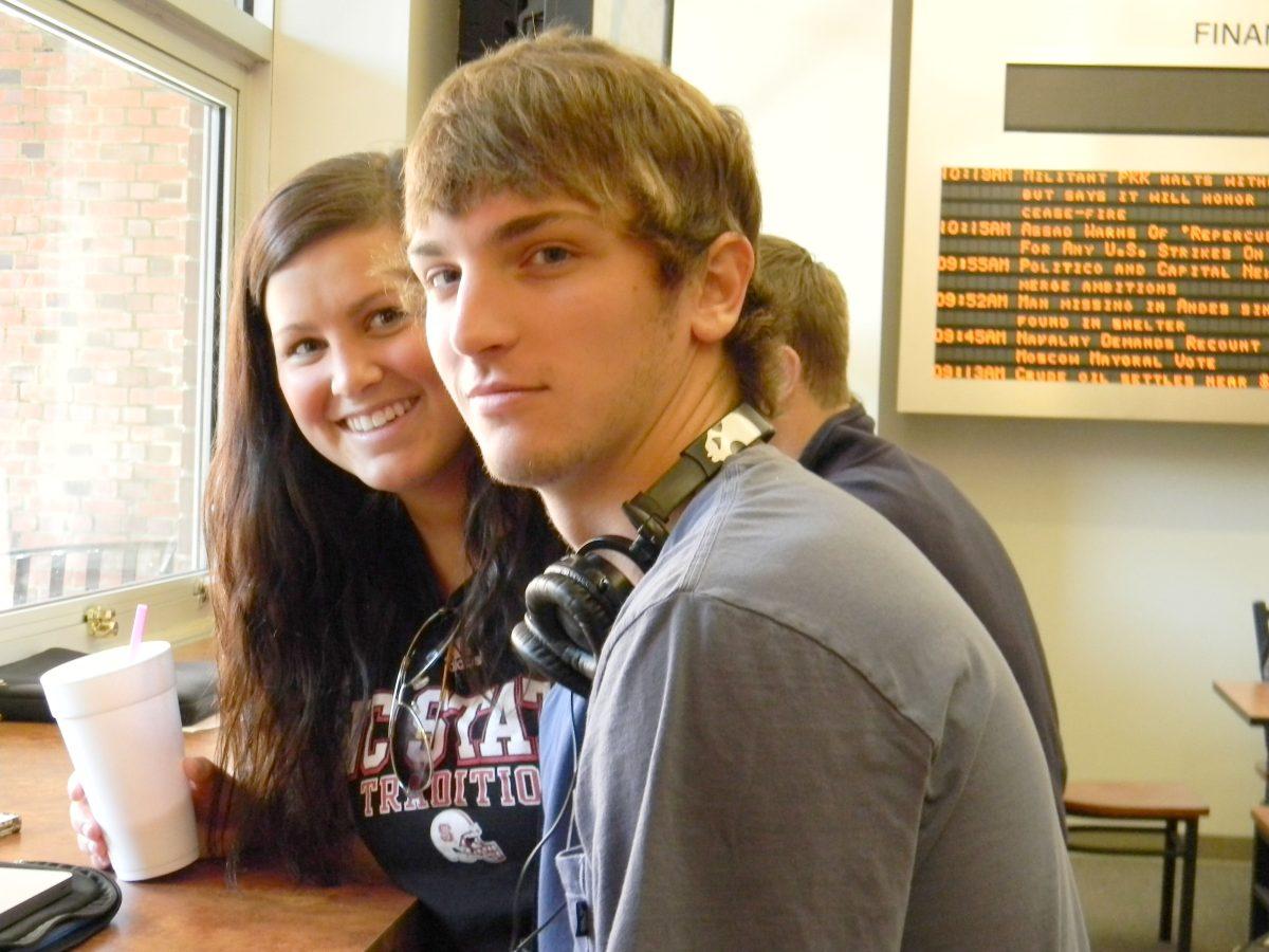 In the Poole College of Management, sophomores Connor Bullard (majoring in business administration) and Phoebe Campbell (majoring in biology and minoring in business) hang out at lunch in the cafe at Nelson Hall.