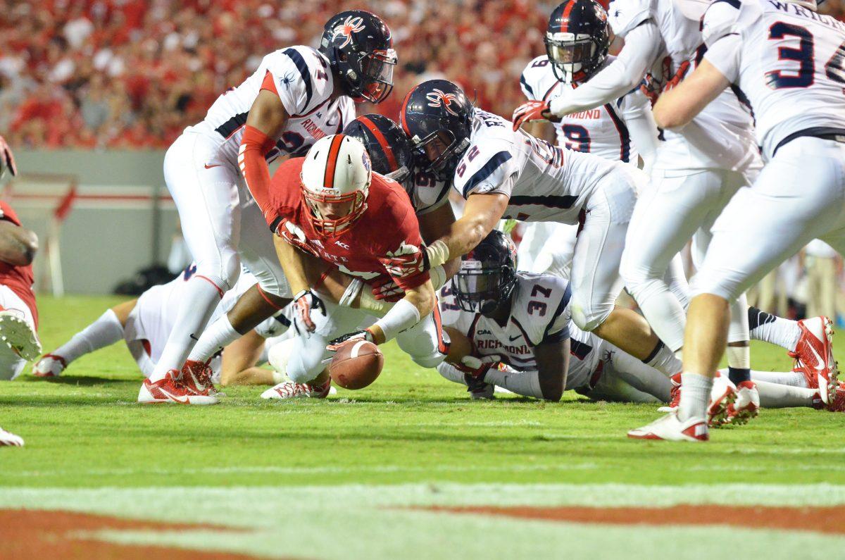 Freshman fullback Bryant Shirreffs fumbles the ball during the football game against the University of Richmond in Carter-Finley Stadium Saturday, Aug. 31, 2013. The Wolfpack narrowly defeated the Spiders 23-21. Photo by John Joyner.