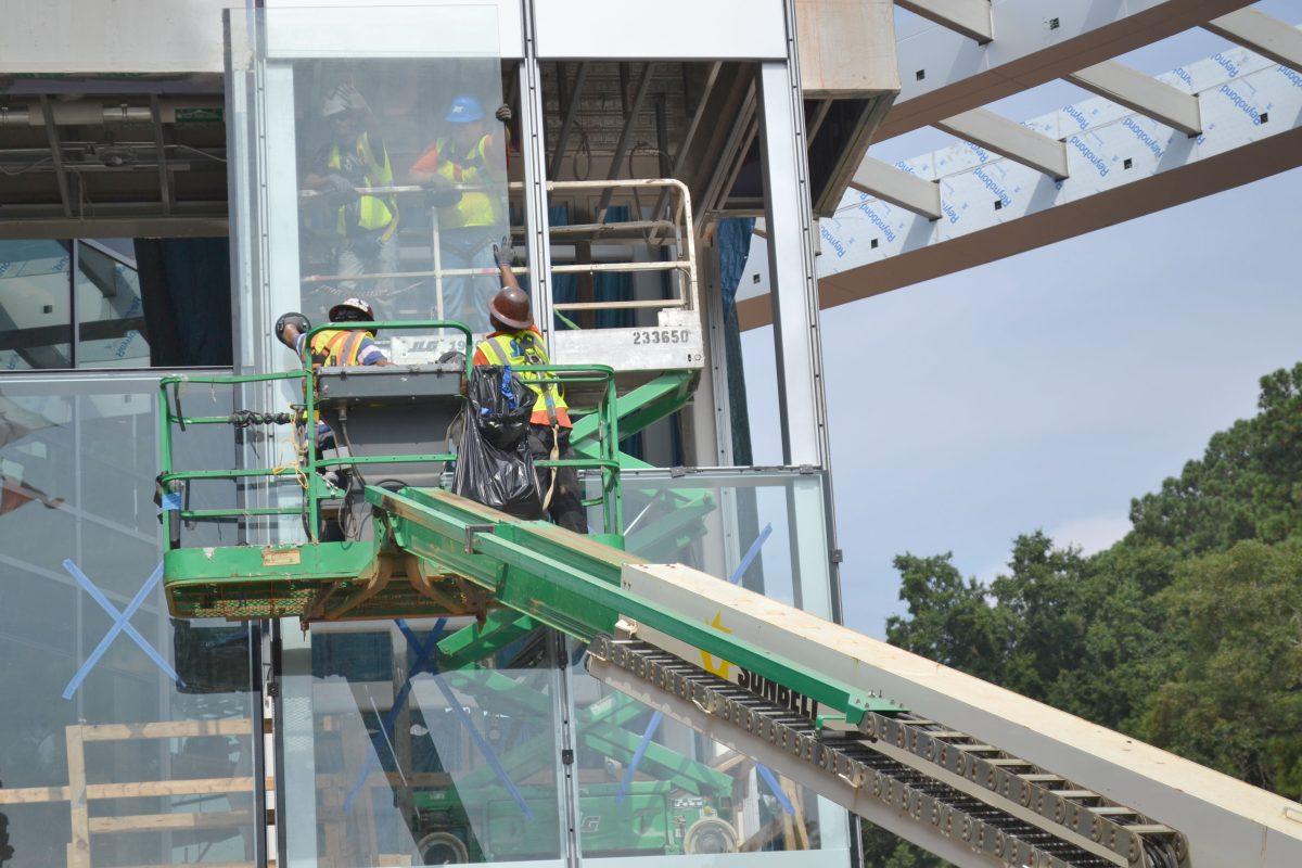 Construction workers install a window pane to Talley Student Center Tuesday Sept. 3, 2013. Recent construction delays have caused frustration amongst students. Photo by Caide Wooten.
