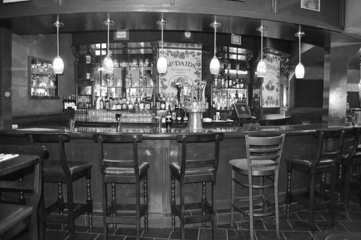 The bar inside McDaids has five Irish beers on tap and many Irish whiskeys to choose from. Photographed by Victoria Crocker.