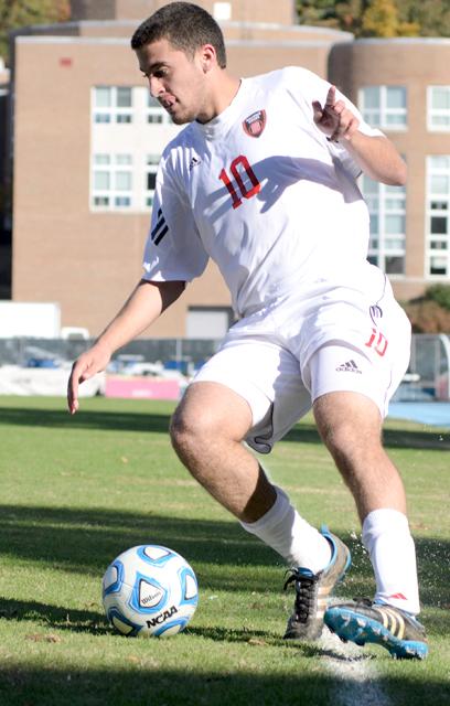 Sophomore forward Nazmi Albadawi stop s a ball rolling down the sideline before moving it towards the Virginia Tech goal during the first round of the ACC Men's Soccer Tournament on Fetzer Field in Chapel Hill on Monday, Nov. 7, 2011. The Wolfpack would defeat the Hokies 1-0, moving them on to the next round against UNC Chapel Hill.