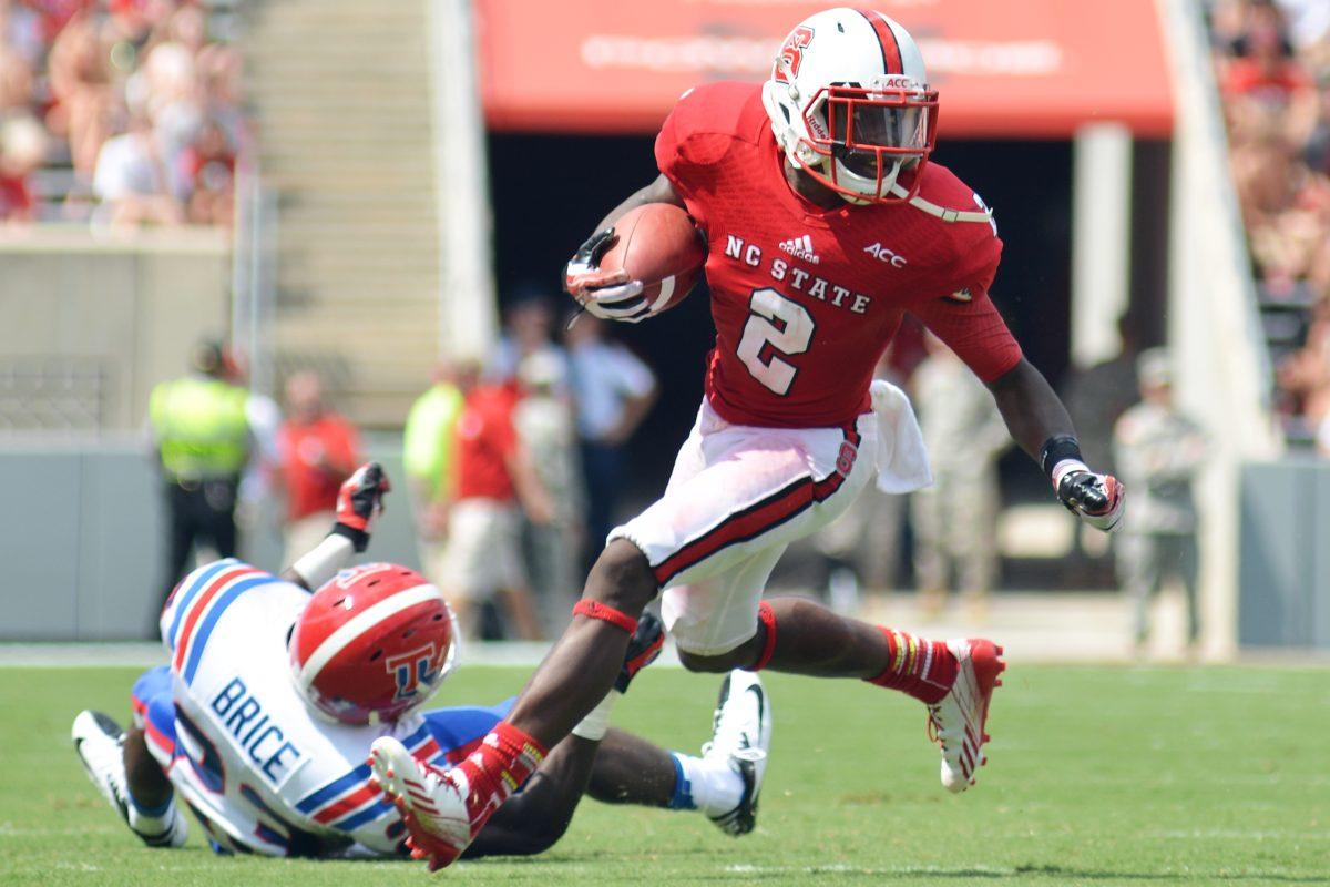 Redshirt senior Rashard Smith runs the football Saturday, Aug. 31, 2013 at Carter-Finley Stadium against Louisiana Tech. The Wolfpack defeated the Bulldogs 40-14.